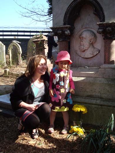 Laying flowers at Henry Richard's grave