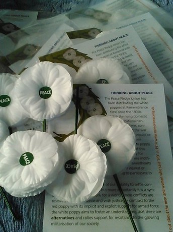 artificial white poppies and leaflets