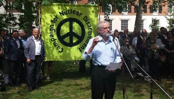 Jeremy Corbyn in the sunshine giving a speech