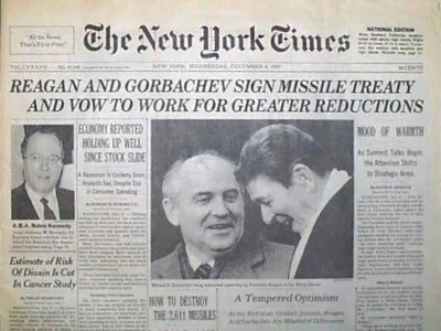 front page of New York Times.  Main headline reads 'Reagan and Gorbachev sign missile treaty and vow to work for greater reductions'