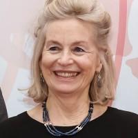 smiling lady with a necklace