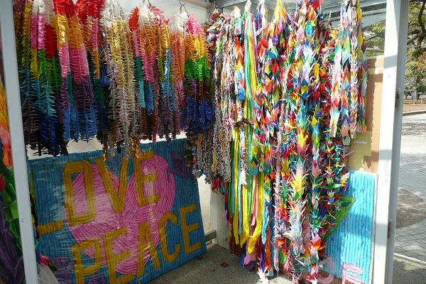 chains of colourful paper cranes hanging up