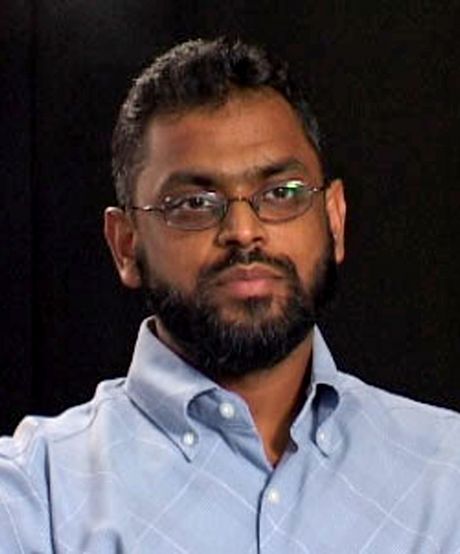 Moazzam Begg in a blue shirt