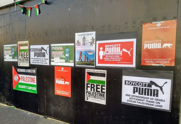 fly posters.  Free Palestine.  Boycott Puma