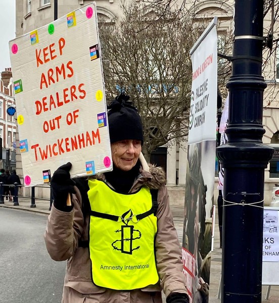 protestor with placard -- keep arms dealers out of Twickenham