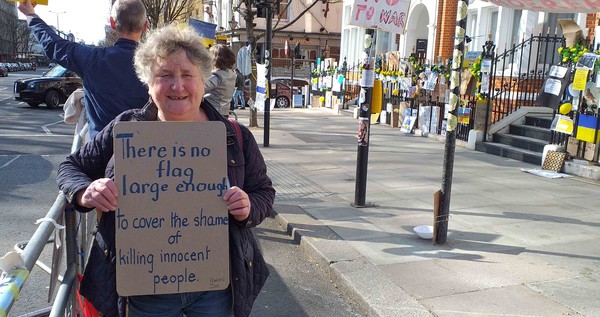 there is no flag large enough to cover the shame of killing innocent people