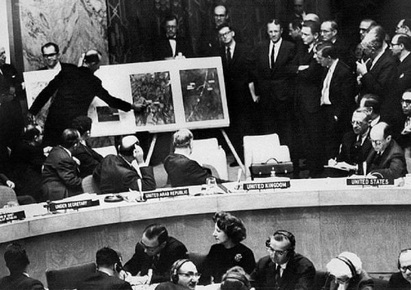 Black and white photo of presentation of photos at the United Nations